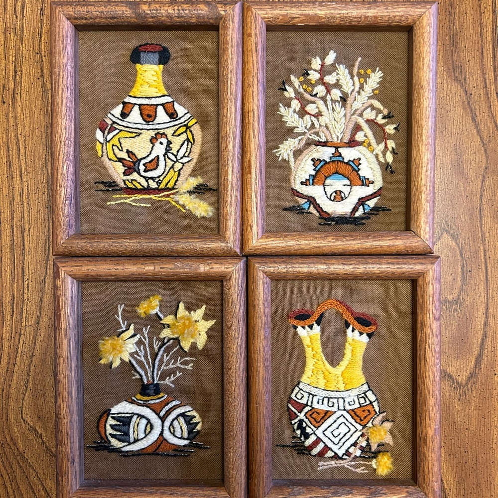 Four framed vintage crewel needlepoint embroidered art. Native American designs.